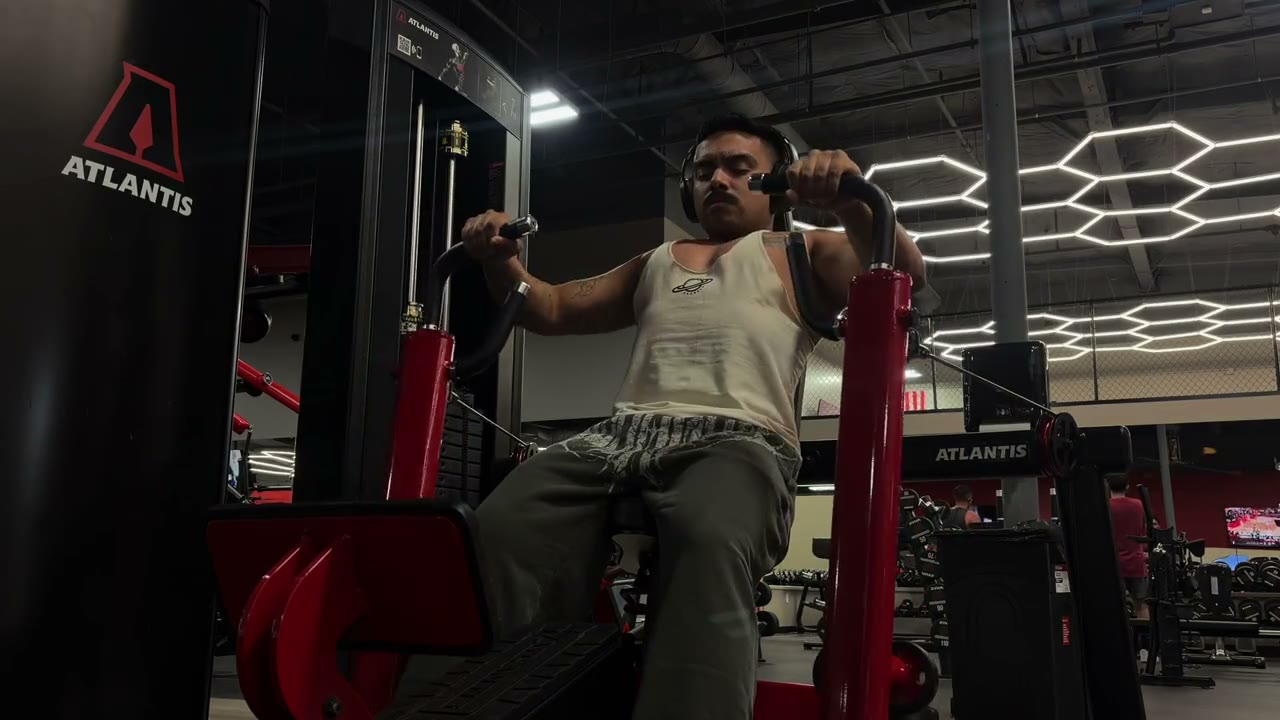 Dominic Alvarez training on a cable machine, cinematic edit